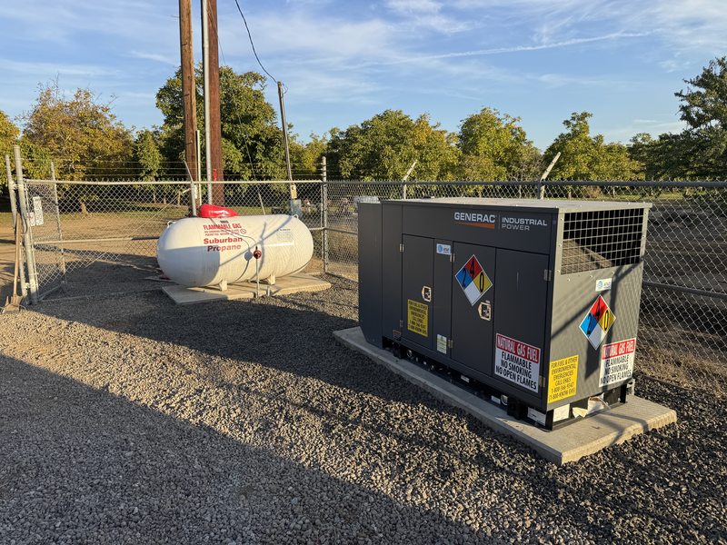 Propane generator installation photographed during golden hour