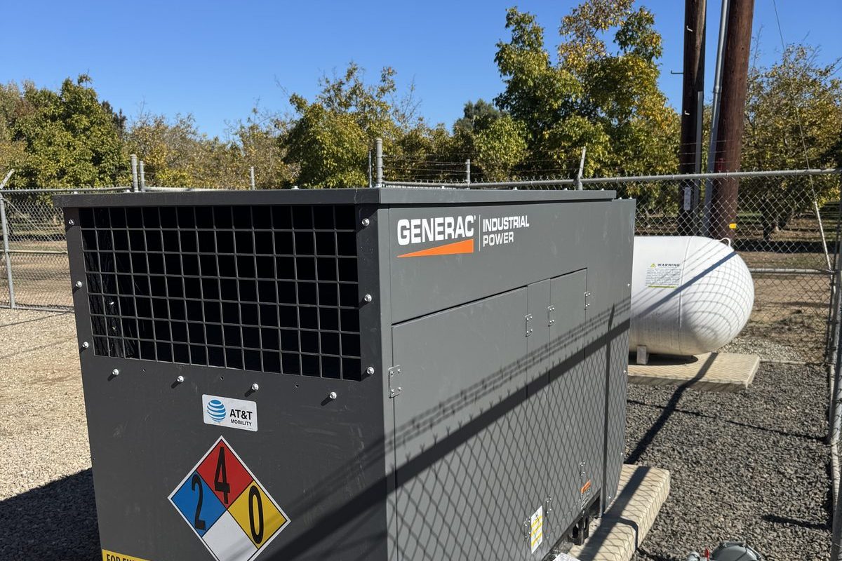 Generac industrial generator with LP tank installed and commissioned by JMES at a remote carrier site